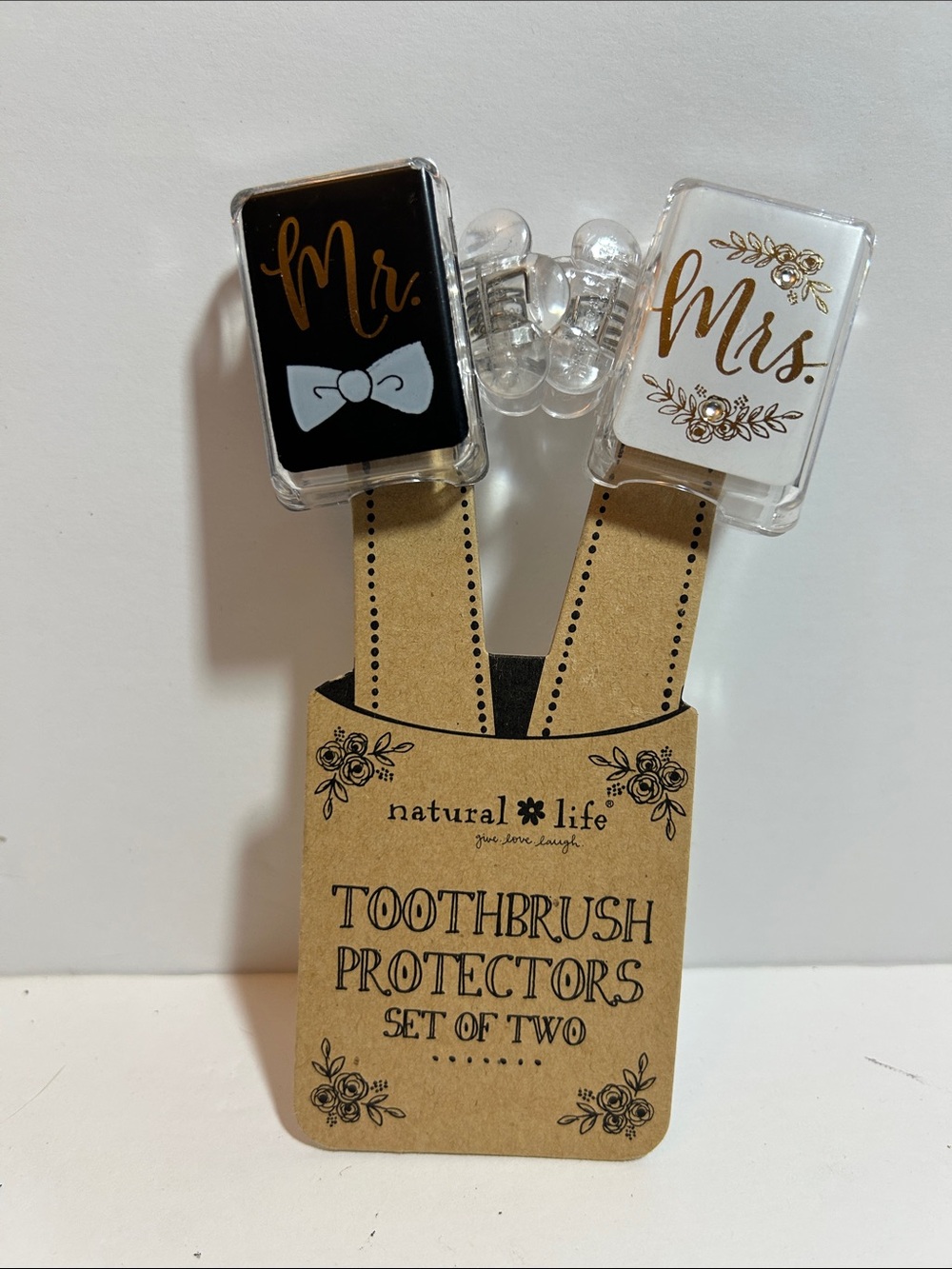 Mr. and Mrs." toothbrush protectors made by Natural Life